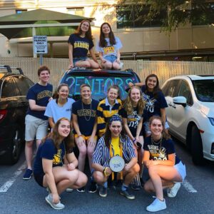 The author and a group of friends in front of a car