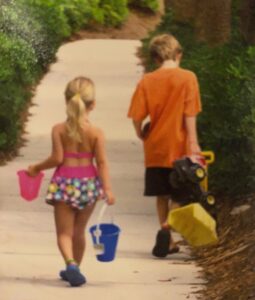 The author and his sister walking to the beach.