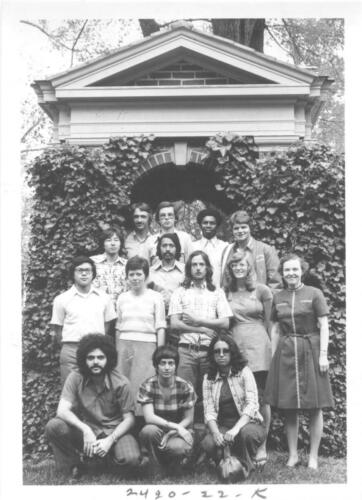 Class of 1976 international students pose under the wishing well